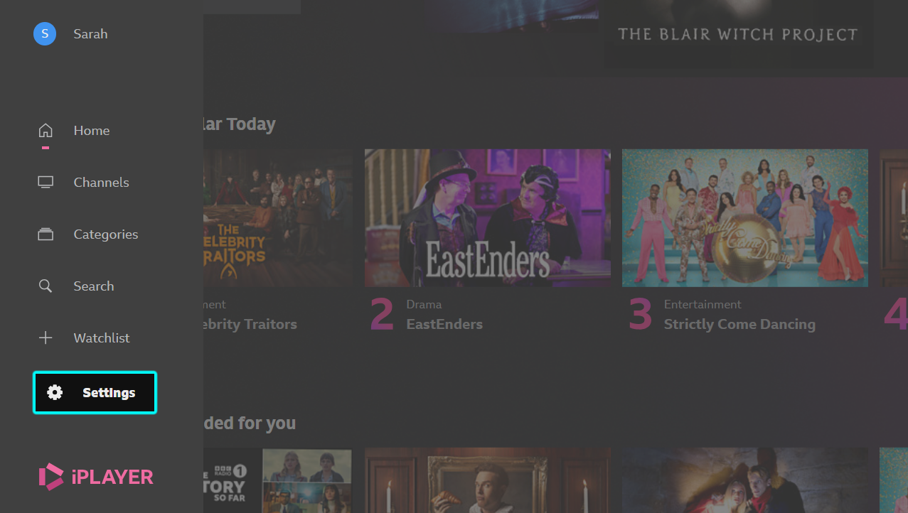 Image showing the BBC iPlayer TV app homepage. The settings icon is highlighted on the bottom of the left-hand menu