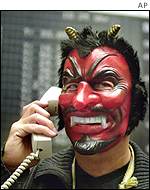 Frankfurt trader dressing up for the carnival, 12 February 2002