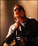 Bono performing in London in 2001