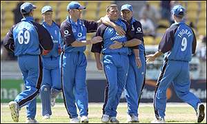 Darren Gough is mobbed by England team-mates after taking Chris Nevin's wicket
