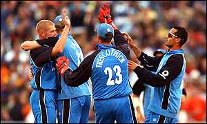 Matthew Hoggard celebrates with team-mates after one of his two wickets 