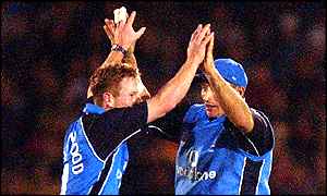 Paul Collingwood celebrates with Nasser Hussain after taking 4-38 in England's win 