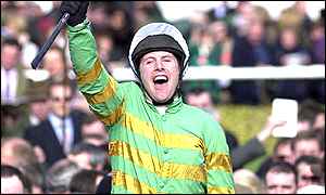 Charlie Swan on Like-a-Butterfly celebrates winning the Gerrard Supreme Novices' Hurdle at Cheltenham 