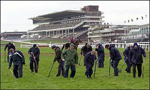 Ground staff work on the Cheltenham course 
