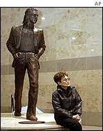 Yoko Ono with statue