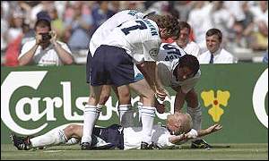 Gazza is soaked by his team-mates as they celebrate his goal against Scotland in Euro 96 