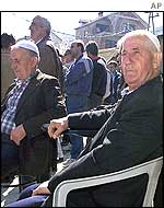 Ethnic Albanians sit in a cafe in Radusa