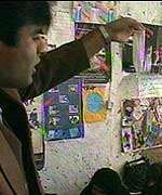 Dr Miradi holds up a condom to a class