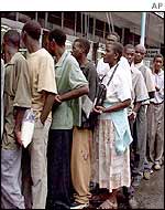 Zimbabweans queue for food in Harare
