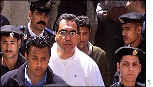 Sherif al-Filali surrounded by security guards