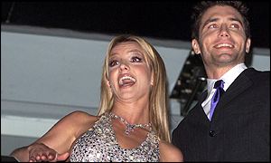 Spears and co-star Anson Mount waved from a balcony