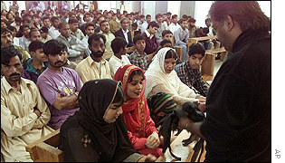 Worshippers in Islamabad offer prayers for those lost in the grenade attack