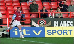 Paul Gascoigne takes a corner for Burnley in a Nationwide league game