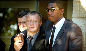 Surrey coach Keith Medlycott and Surrey and England player Alex Tudor leave the service 