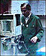 A man makes a groove in whistles shafts