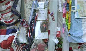 Tributes to World Trade Center victims cover a wall