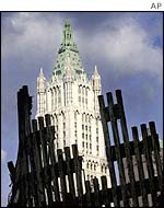 The Woolworth Building rises behind the ruins of the World Trade Center