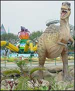 A giant dinosaur stands guard at the park