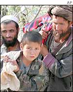 Refugee family crosses the Khyber Pass between Afghanistan and Pakistan