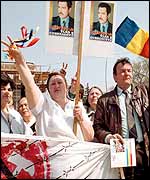 Moldovan protesters show posters of Vlad Cubreacov who has disappaeared