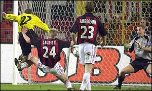 Amoroso powers home a fierce strike to put Dortmund two up against AC Milan