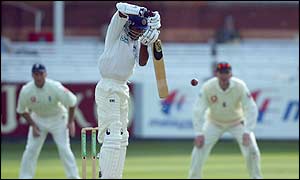 Kumar Sangakkara of Sri Lanka fends off the ball as England put Sri Lanka back into bat 