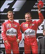 Schumacher pulled Barrichello onto the top step of the podium after being let through into the lead feet from the finish line