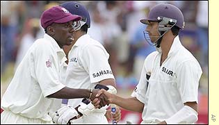 West Indian Pedro Collins shakes hands with India's batsman Ashish Nehra at the end of the match
