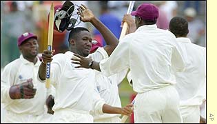 Wavell Hinds of the West Indies grabs the stumps after the win