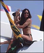 Two sunbathers enjoy the Monaco Grand Prix