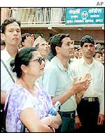 Nepali Congress members gather before the party headquarters seeking information