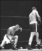 Rocky Marciano walks away from Jersey Joe Walcott