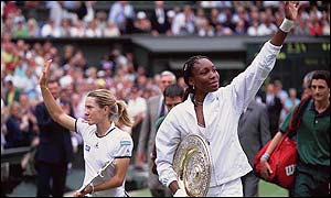 Venus Williams beats Belgium's Justine Henin (left) to retain her title in 2001