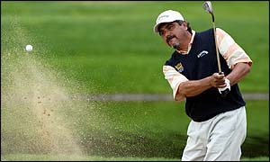 Argentine Eduardo Romero chips out of a bunker