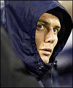 ACT fly-half Stephen Larkham watches from the sidelines after injuring his arm