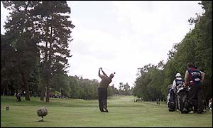 Colin Montgomerie drives down the fairway at the second hole