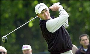 Wales' Phillip Price drives at the third hole