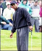 Tiger Woods watches as he misses at putt during the third round