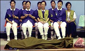 Buddhist pray near crash victim