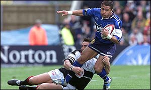 Sonny Parker of Pontypridd tackles Sale's Jason Robinson