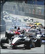 David Coulthard leads at the first corner of the Monaco Grand Prix