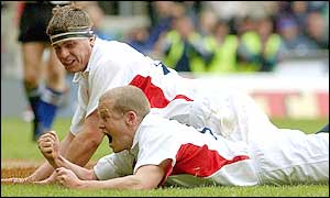 England's Dave Walder celebrates his try with Ben Johnston