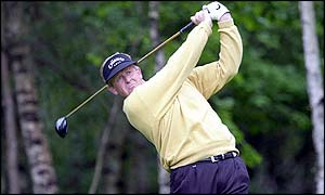 Colin Montgomerie tees off at the 13th hole