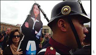 Betancourt's mother, Yolanda Pulacio, with cut-out of daughter on polling day