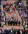The Queen's carriage is escorted by the Household Cavalry Mounted Regiment down the Royal Mile in Edinburgh 