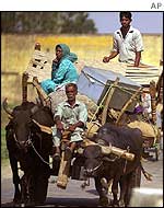 Villagers leave the Jammu area