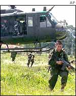 Colombian police secure a field after landing near Popayan