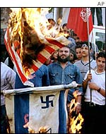 Palestinians burn US and Israeli flags