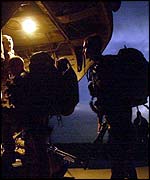 Royal Marines of 45 Commando boarding a helicopter in Afghanistan taking part in Operation Buzzard 