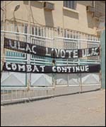 Banner calling for a boycott